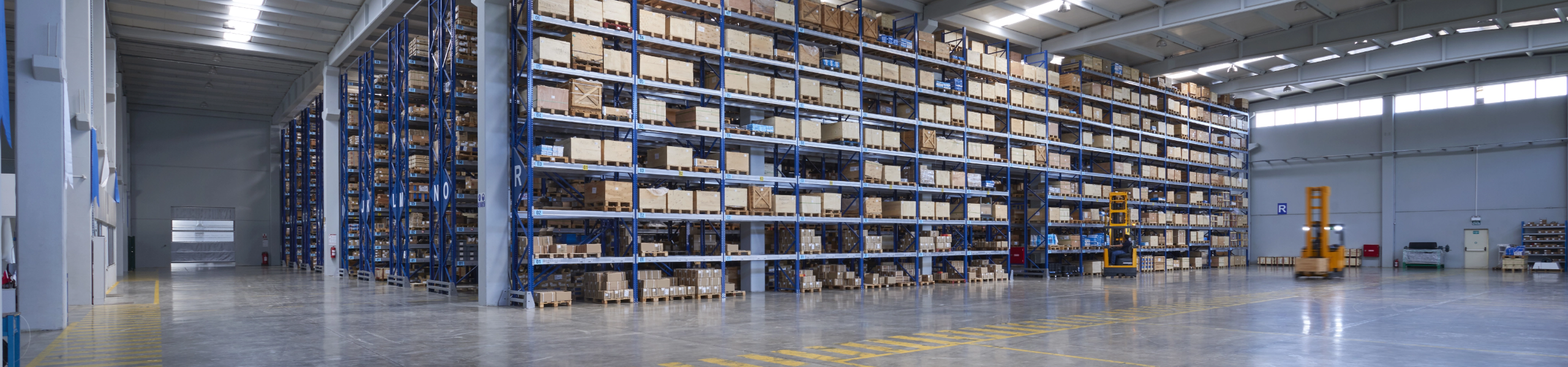 Chapter 2 image Large warehouse wall with forklift trucks